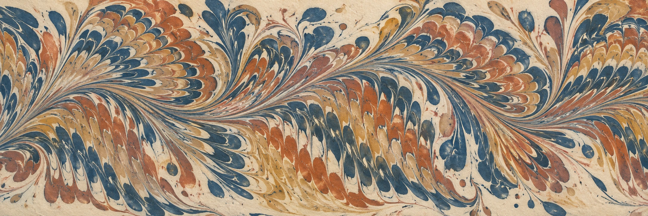 Indigo, terracotta and ochre marbled waves sweep across a wide matte ivory paper surface.