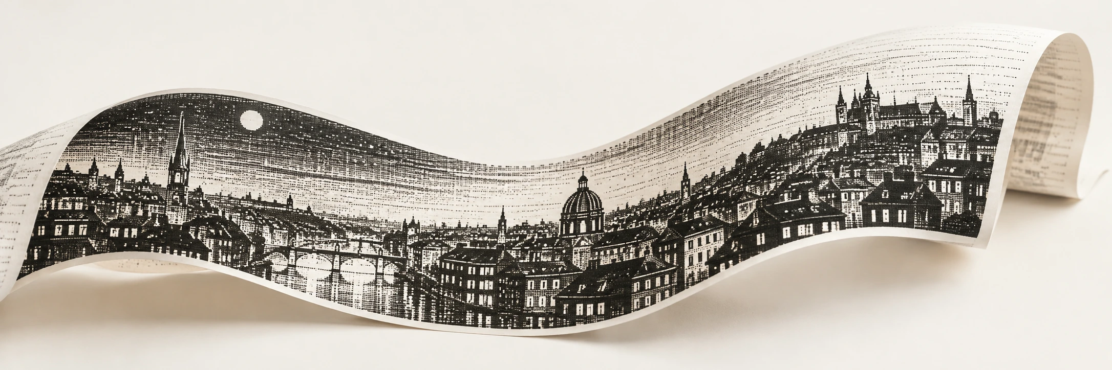 A curling white paper ribbon carries a black raster city of roofs and illuminated windows.